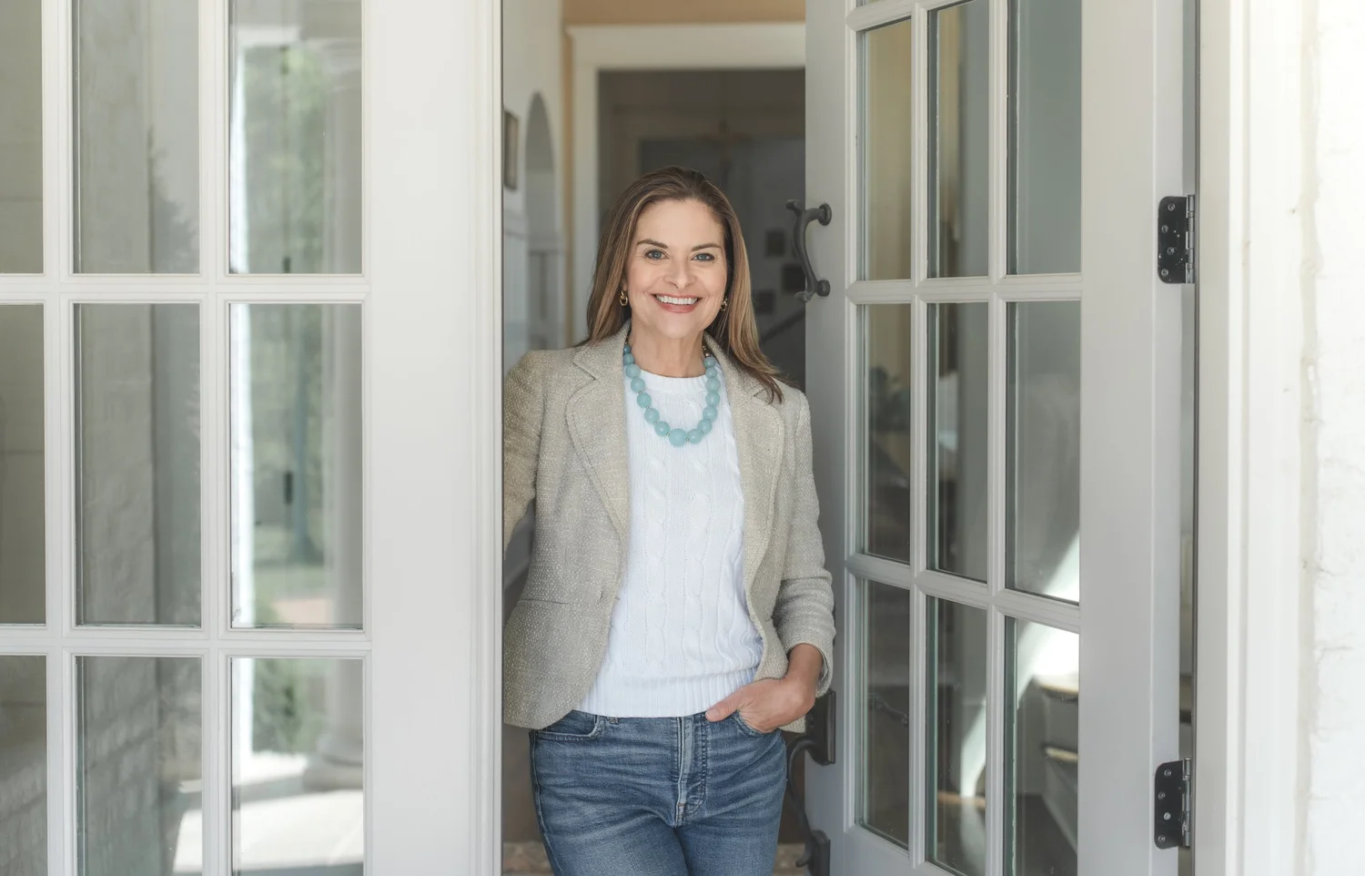 Leigh Ann Hardie standing in an open doorway of a Nashville home